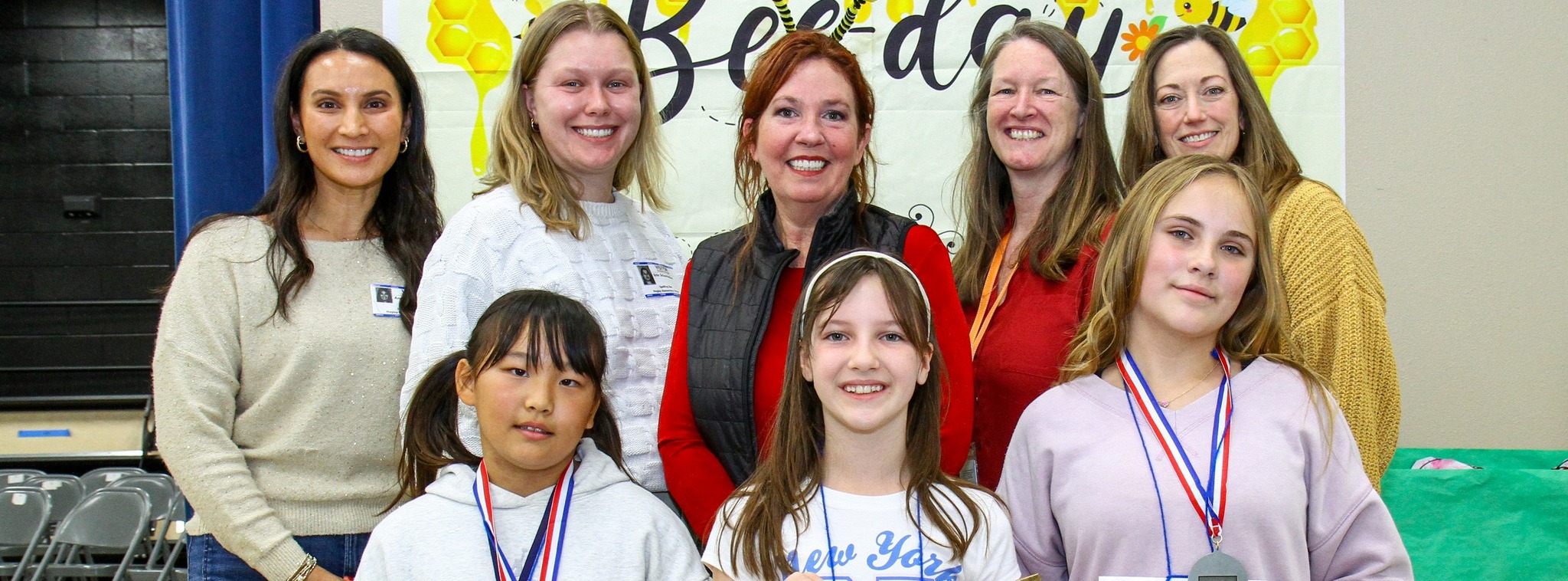 Spelling bee winners with judges and admin