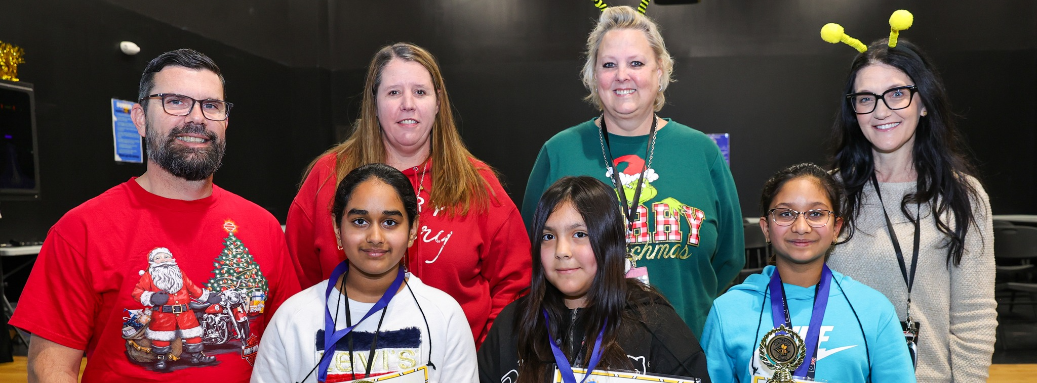 Spelling bee judges with first and second place spelling bee winners