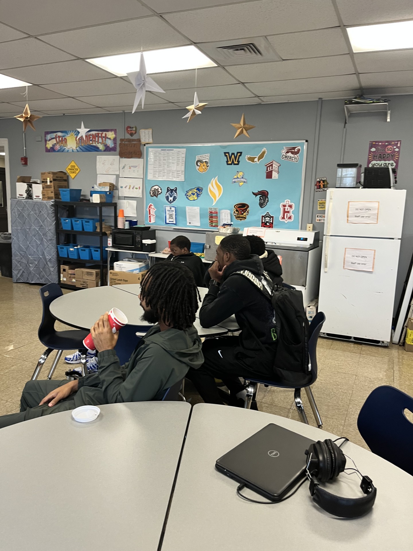Students sitting at the table engaged in the DCCC presentation.