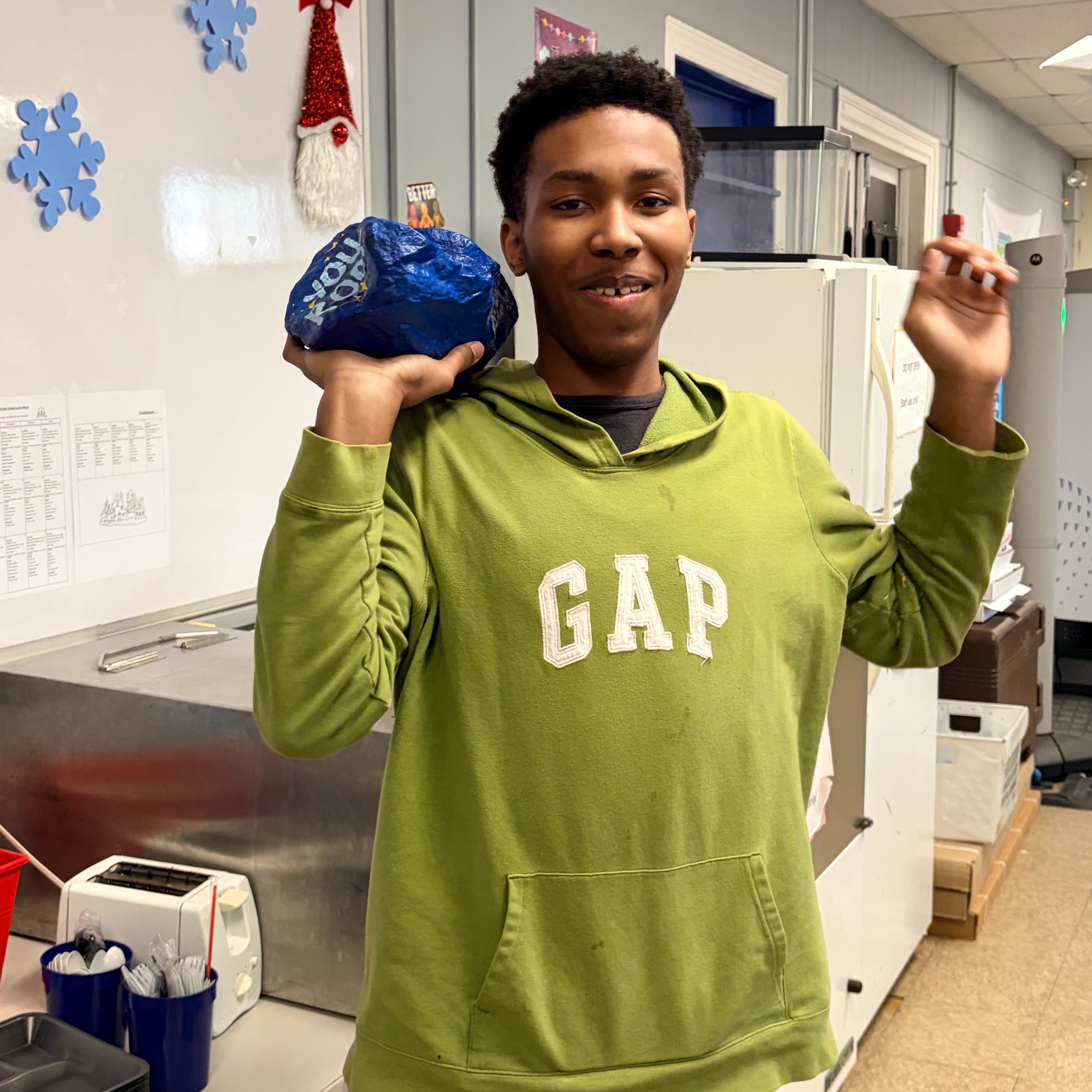 "You Rock" Student of the month smiling and excited for his accomplishments.