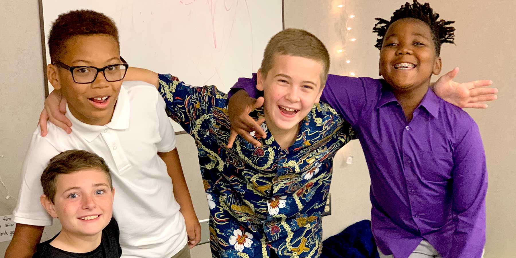 4 students smiling for photo