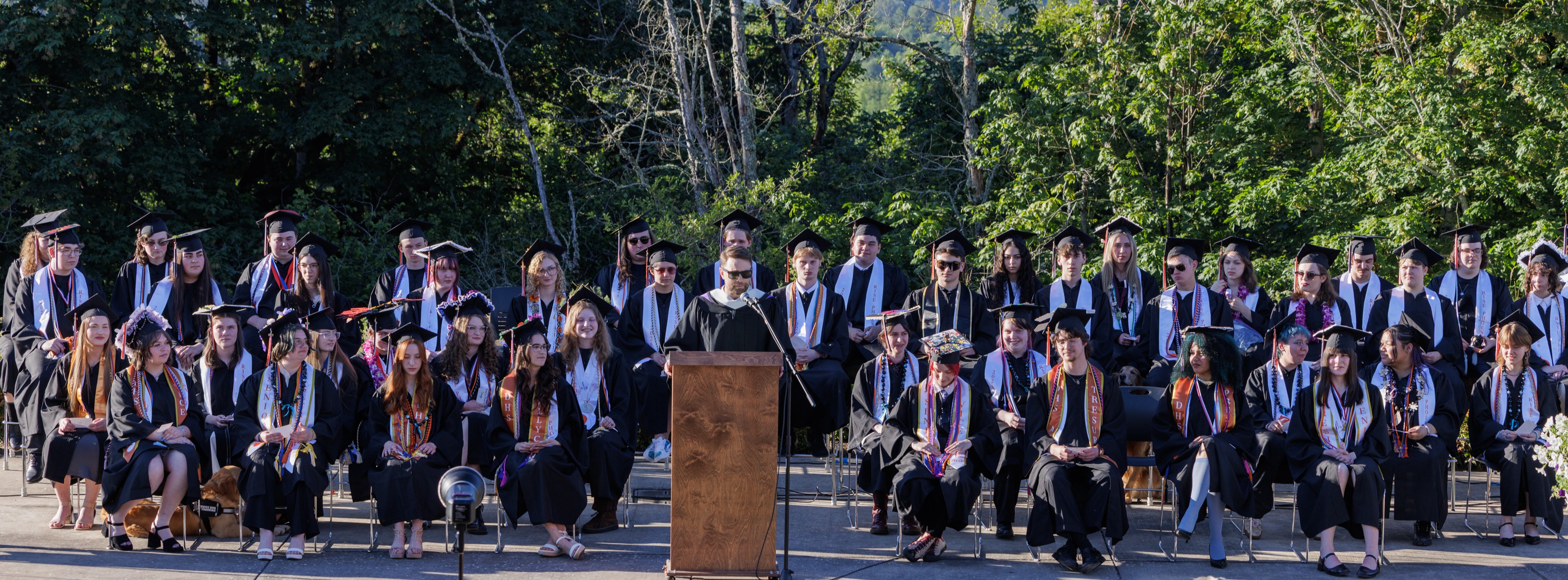 Images of Discovery High School chalk board/ students and graduation 