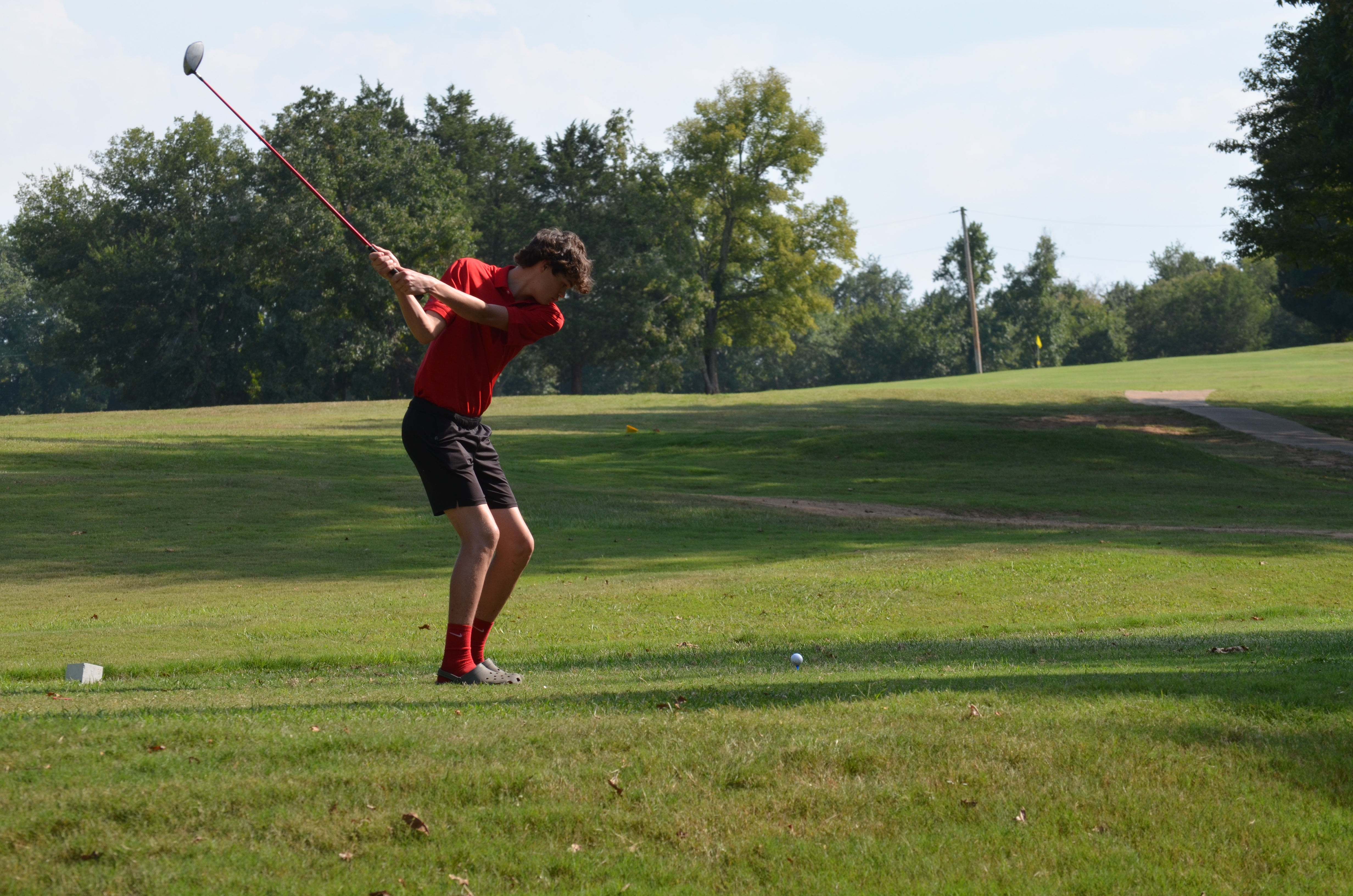 Student golfing 