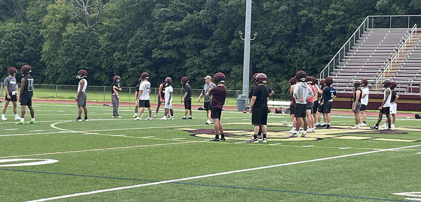 football team on field for first practice of the season
