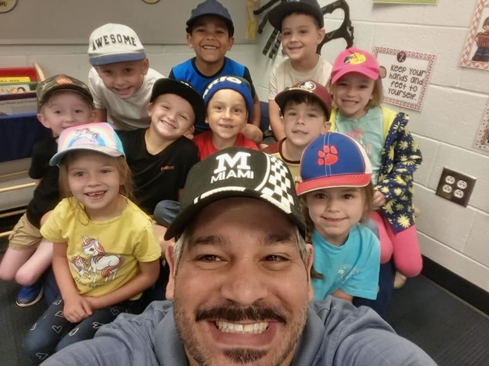 teacher and students smiling