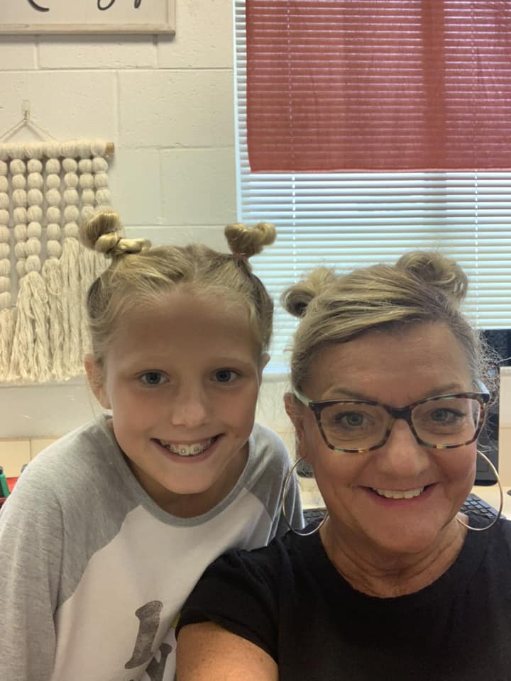 teacher and students smiling