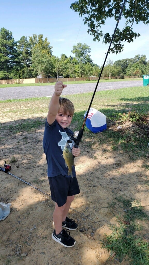 Small Boy holding a fish