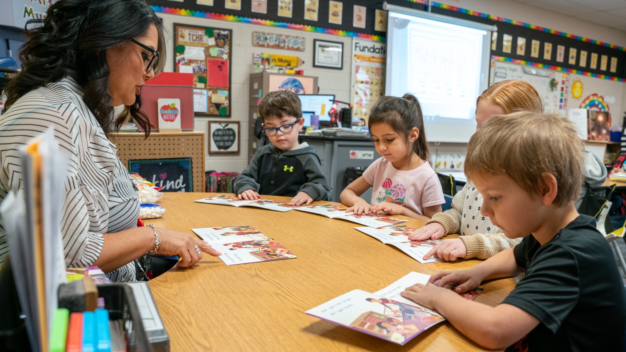 Kindergartener coloring with crayons