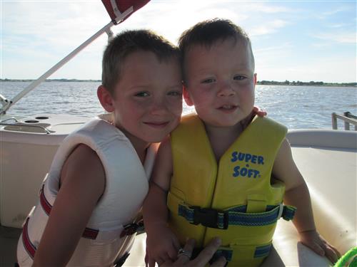 Smiling boys on boat