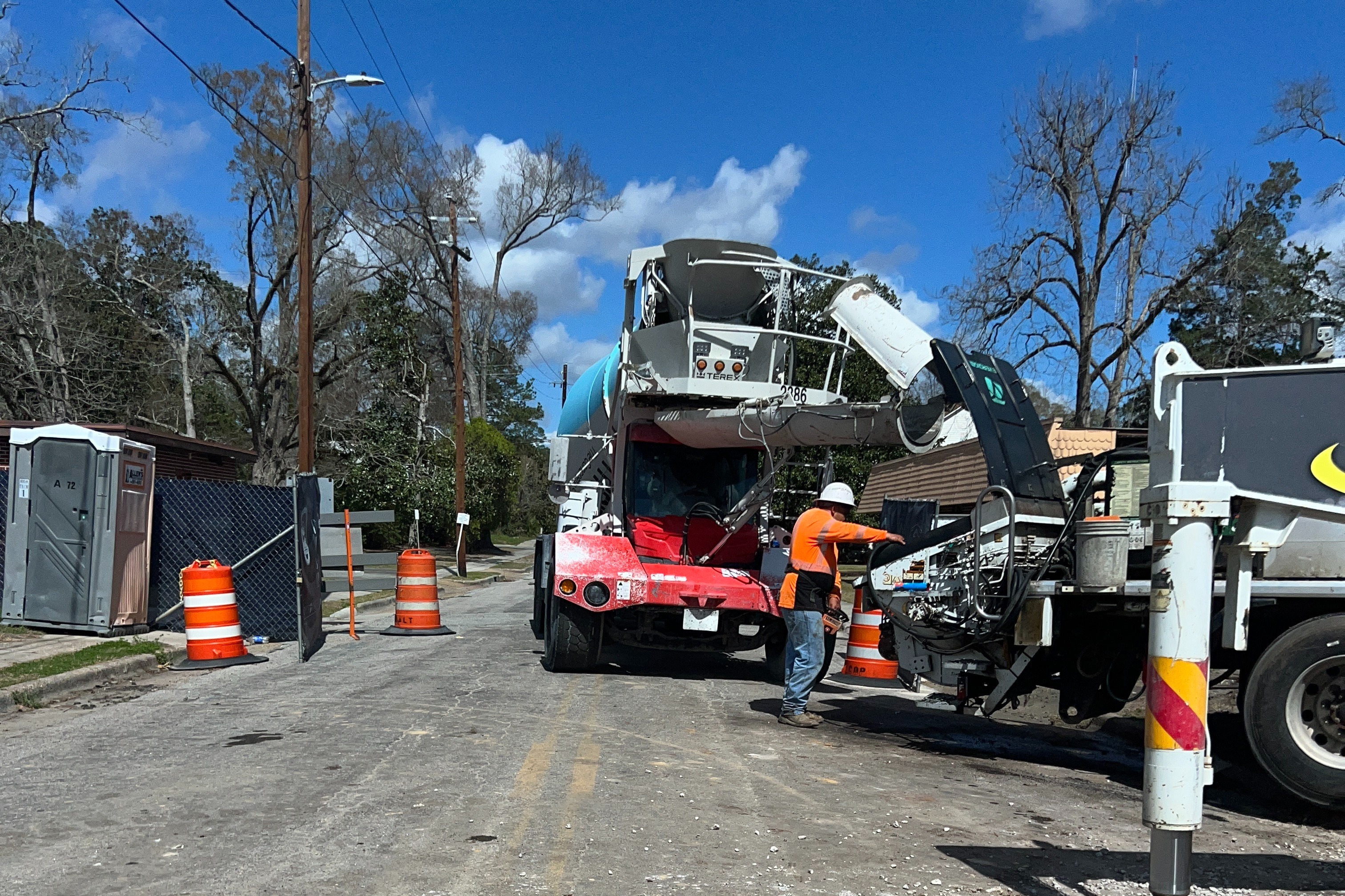 Heaving machinery mixing and pouring concrete