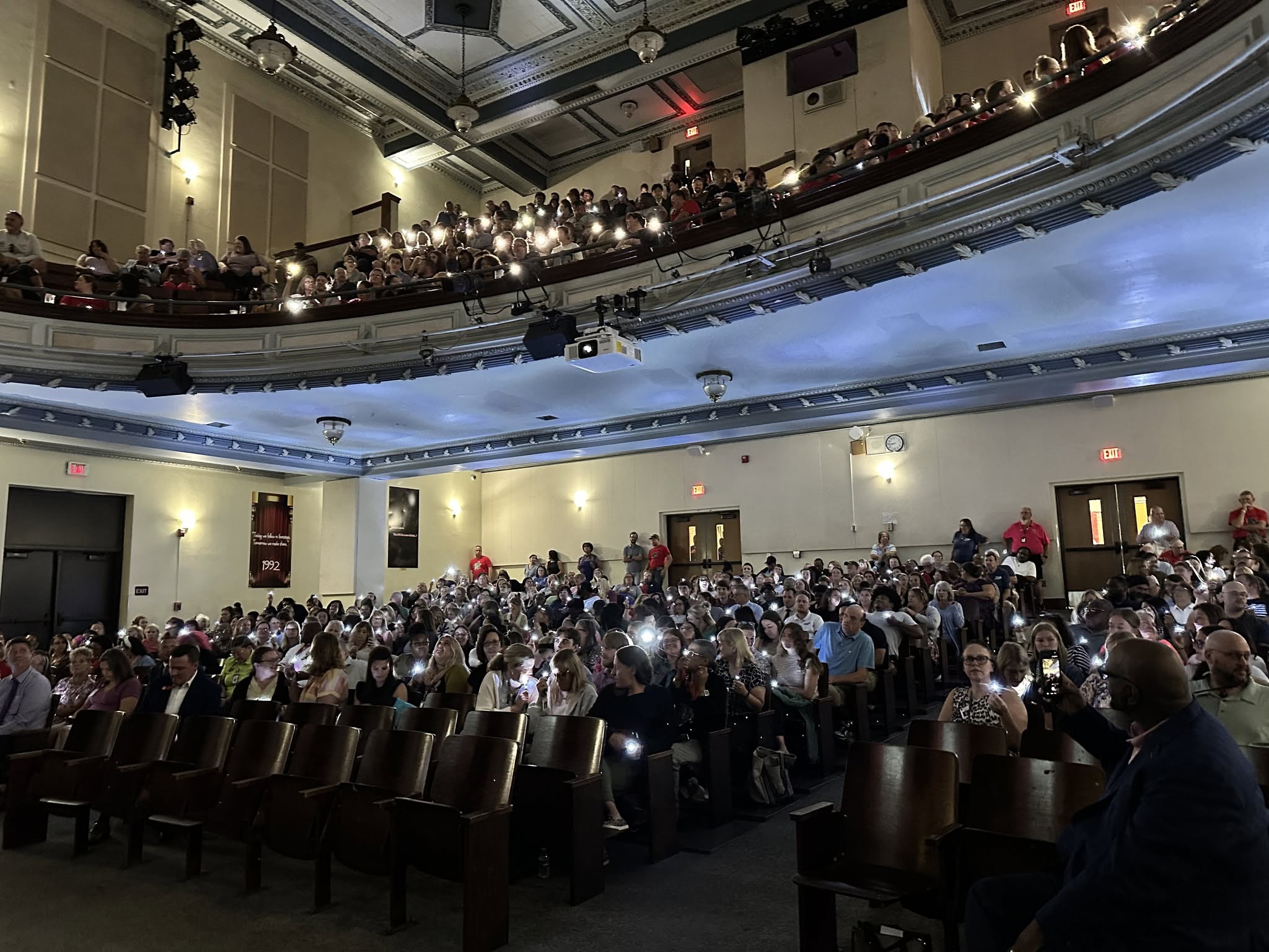 The audience shines thier small flashlights
