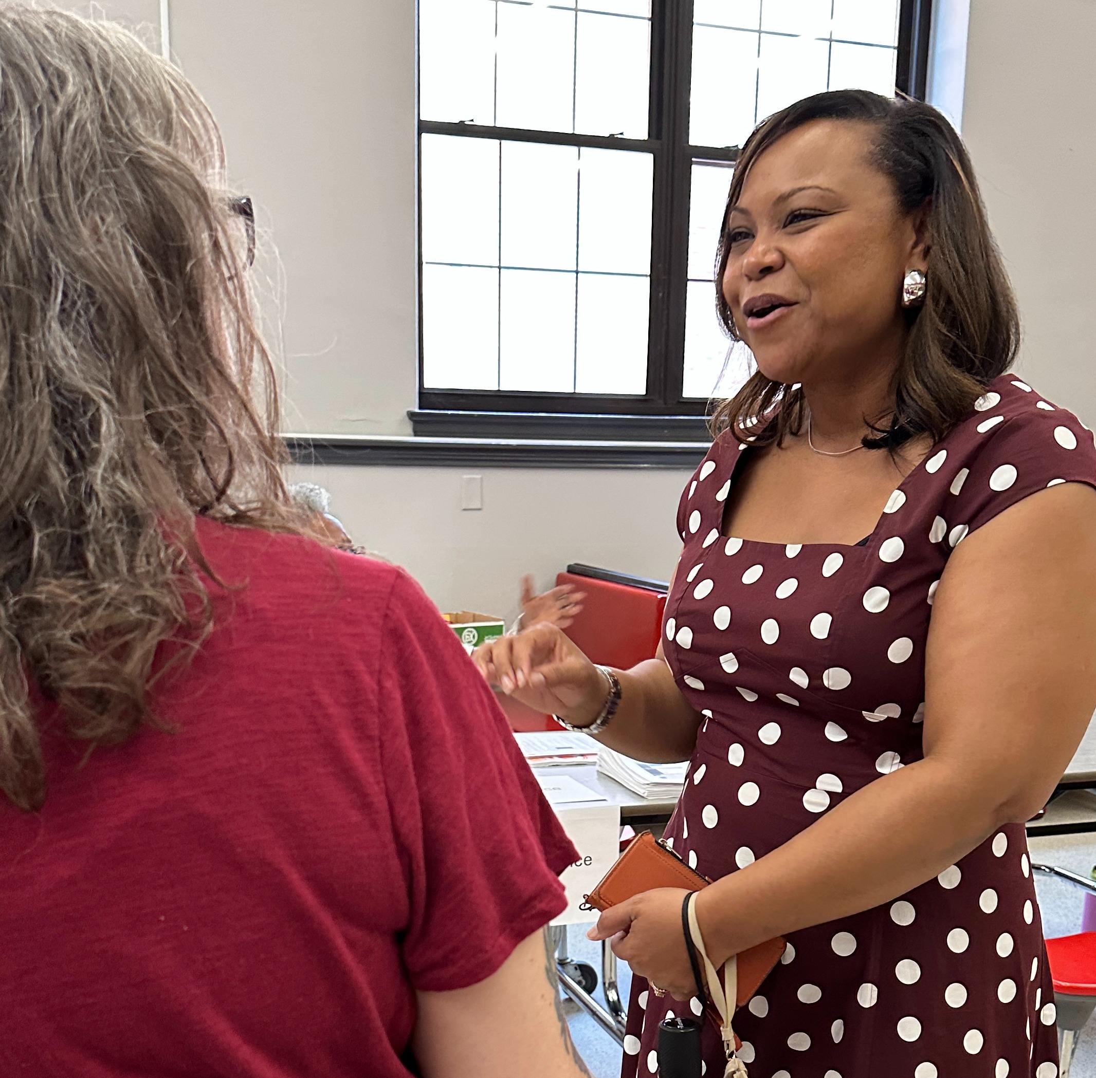 Superintendent Flucas talks with a parent