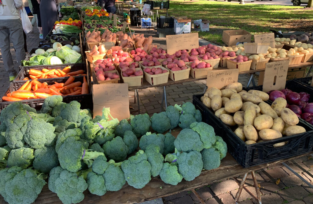 Farmers market table with a colorful spread of produce