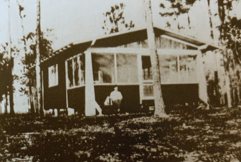Cal Palmer in front of the Cal Palmer Building, c. 1912