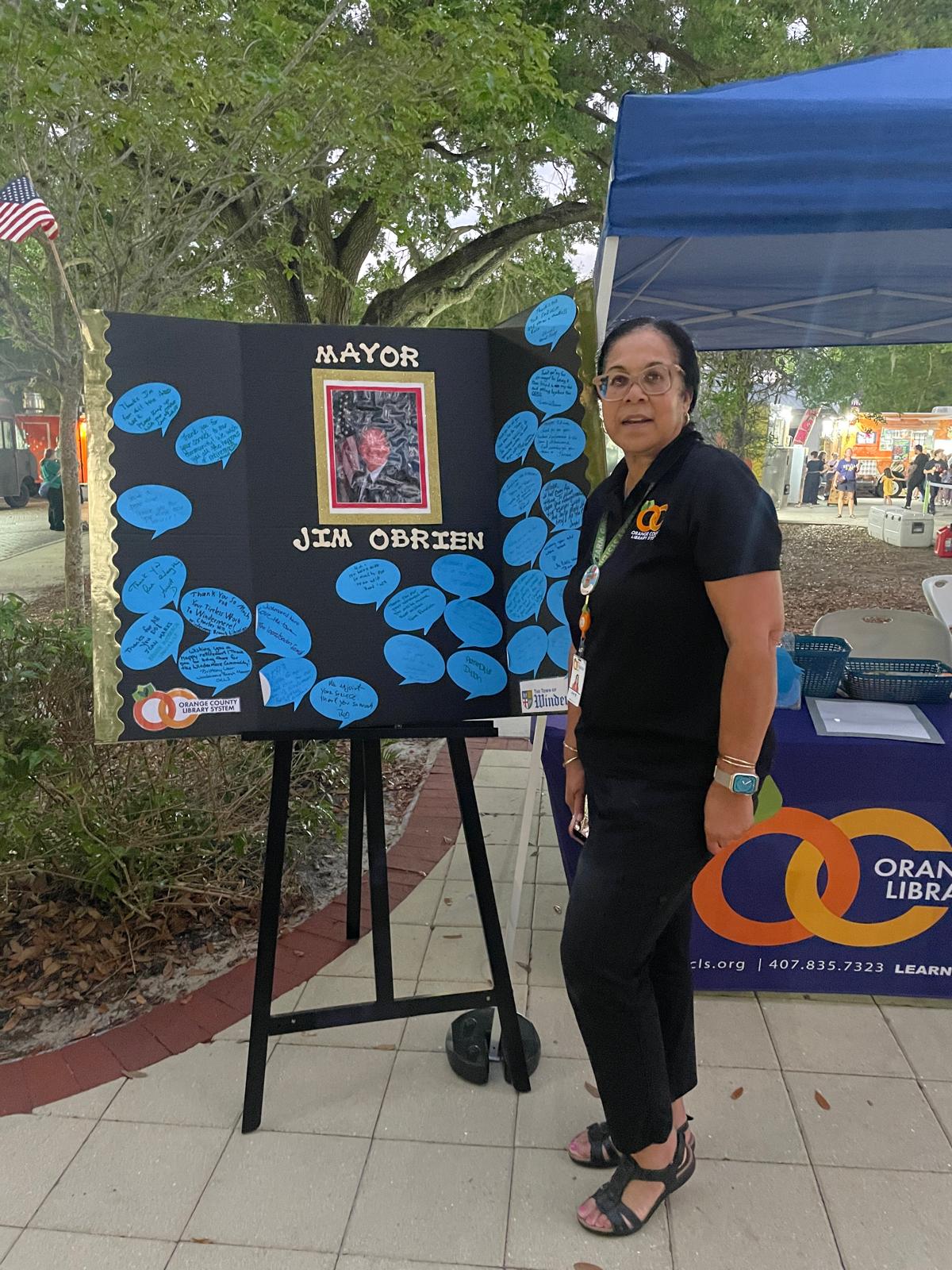 Ms. Joan Marks from Windermere Library with a special gift to the mayor. 
