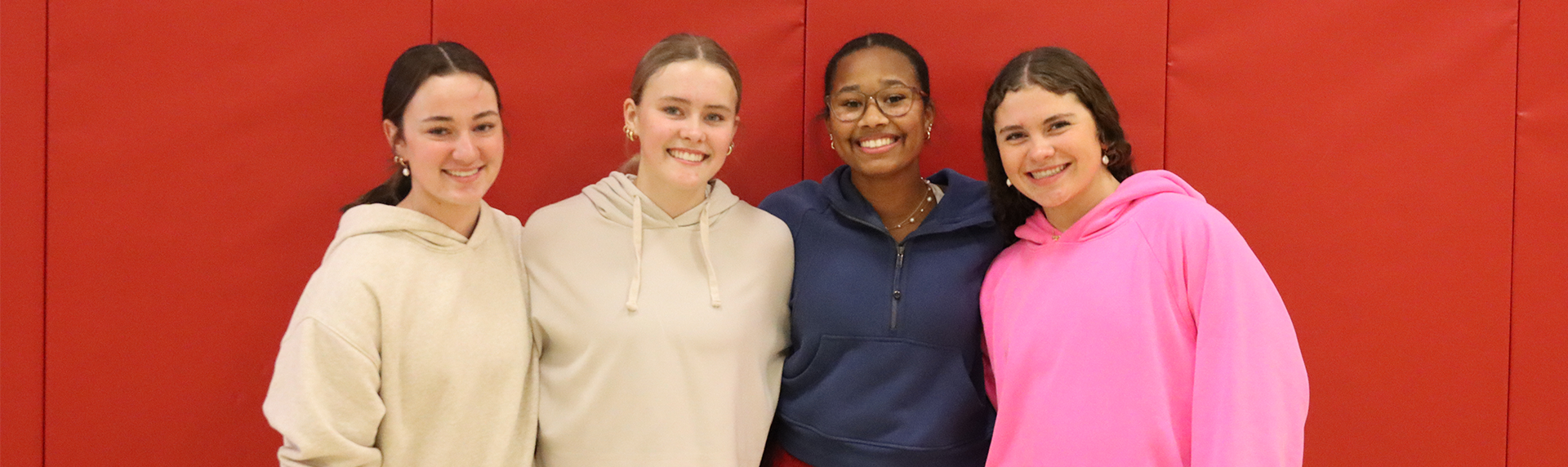 Sophomore girls pose for a picture during pe class