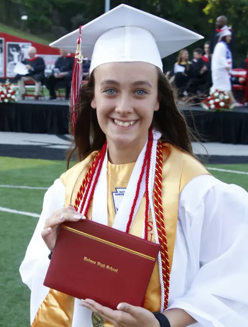 student smiling graduating