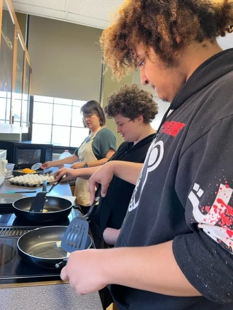 2 students cooking 