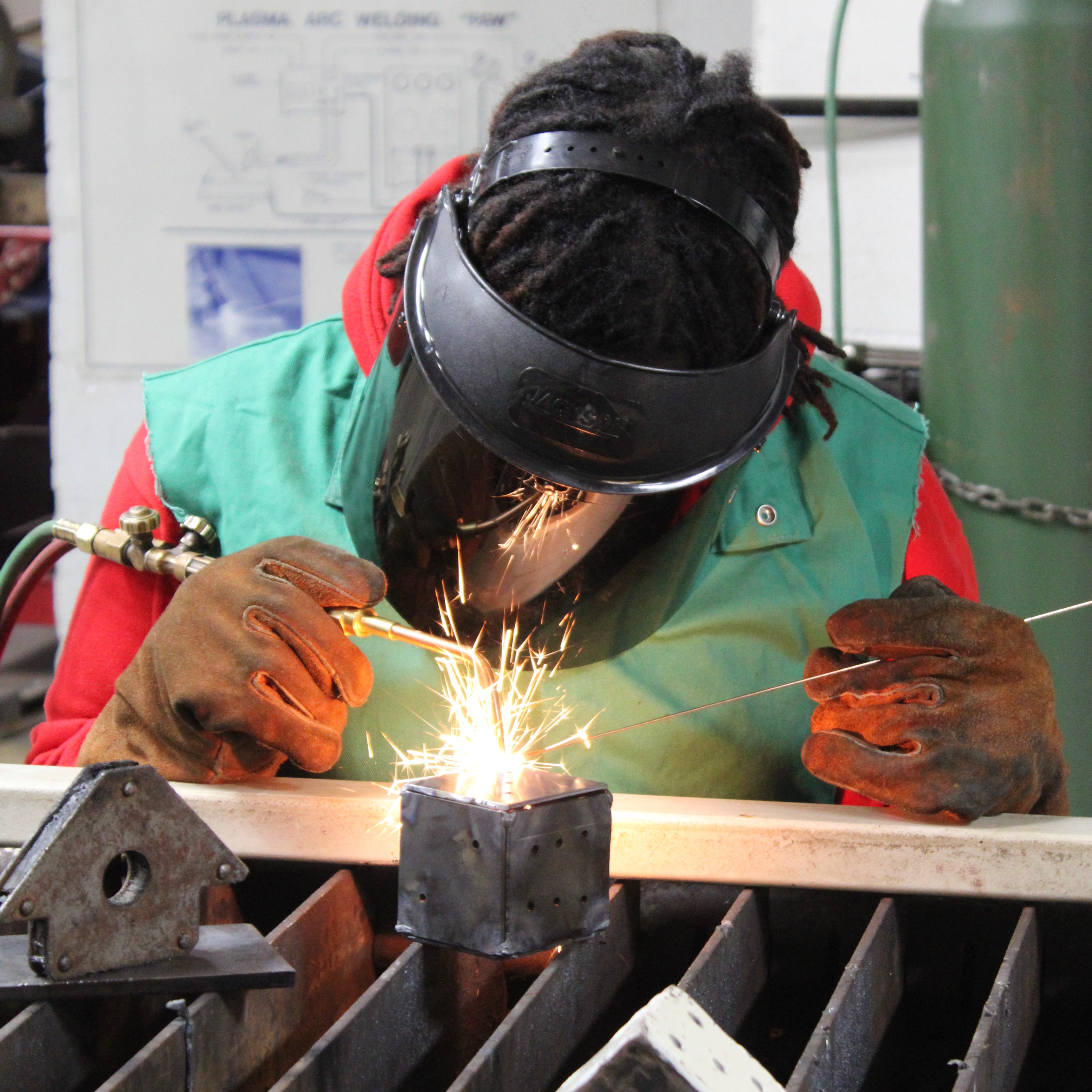 boy welding in welding class