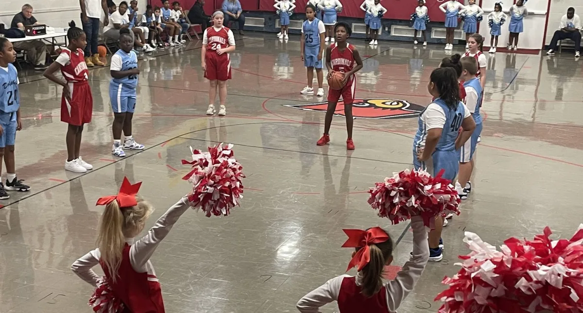 kids playing basketball on a game 