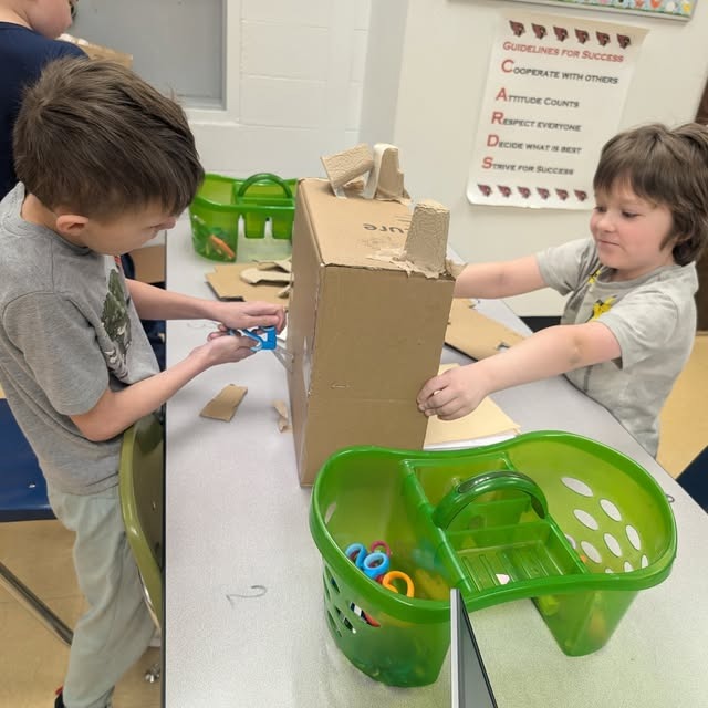 two boys create a box monster