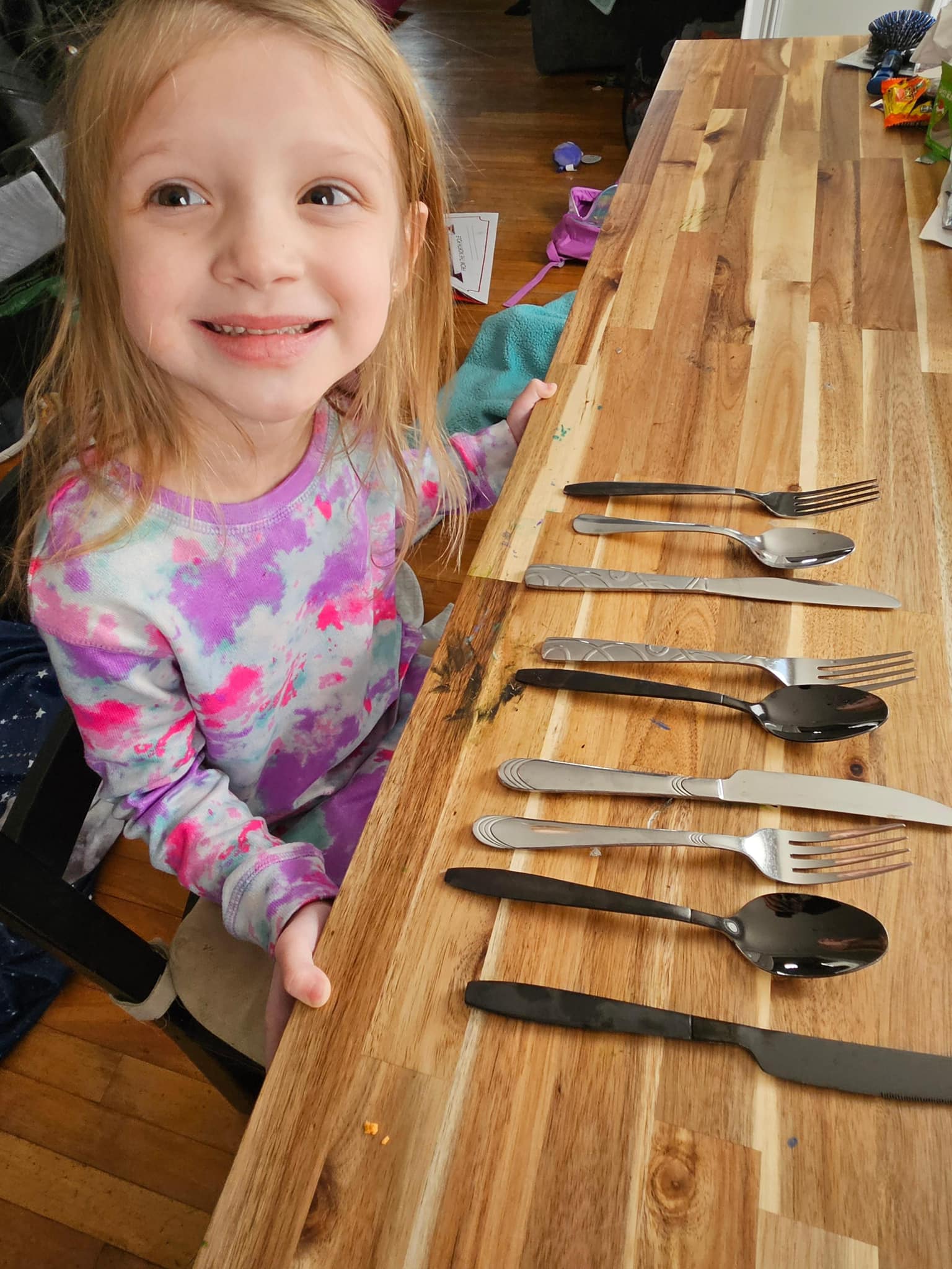 young girl with silverware