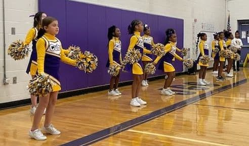 Cheerleading team dancing 