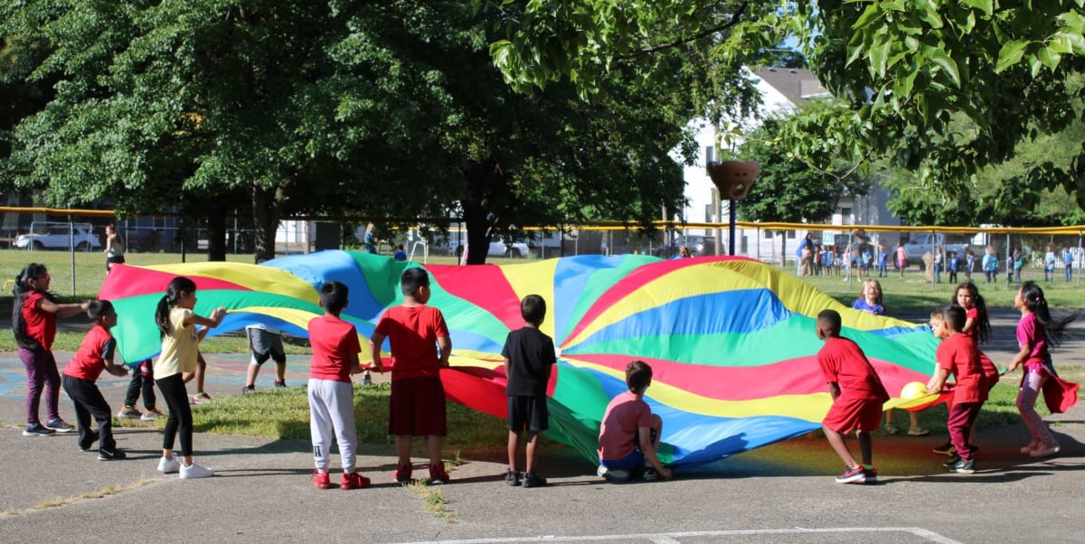 kids in activity with a big balloon