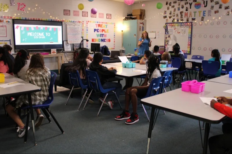 teacher teaching on classroom