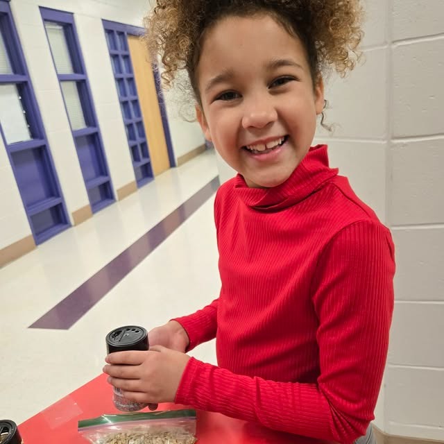 female student smiles at the camera