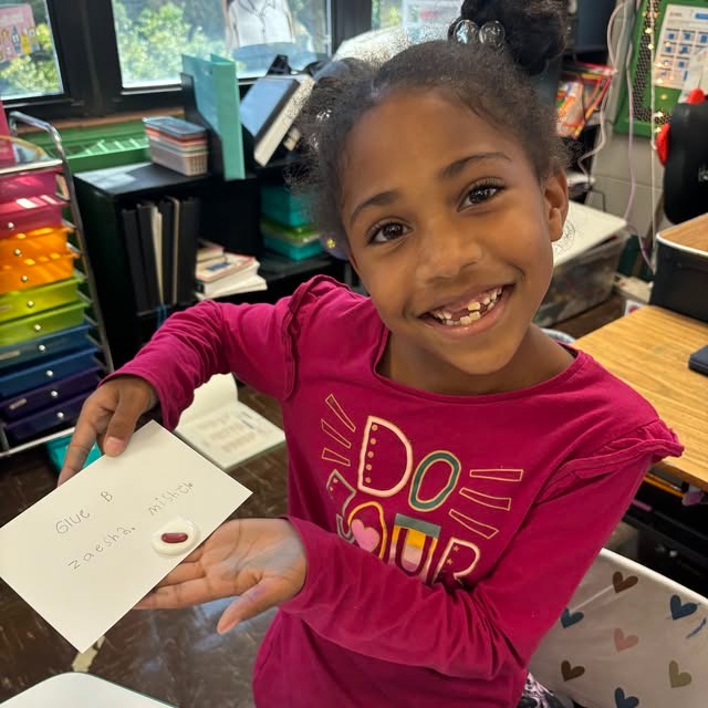 student displays her work