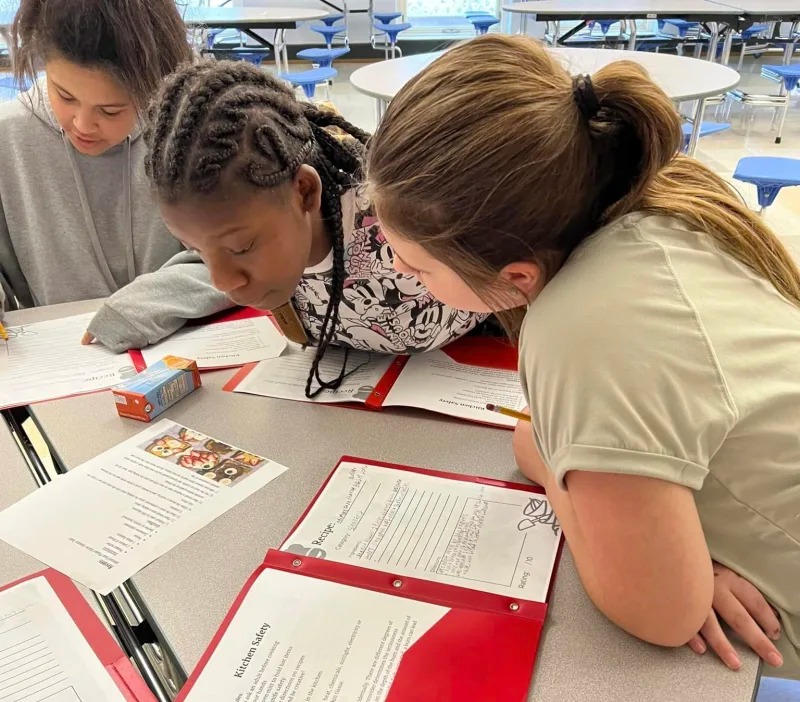3 kids studying