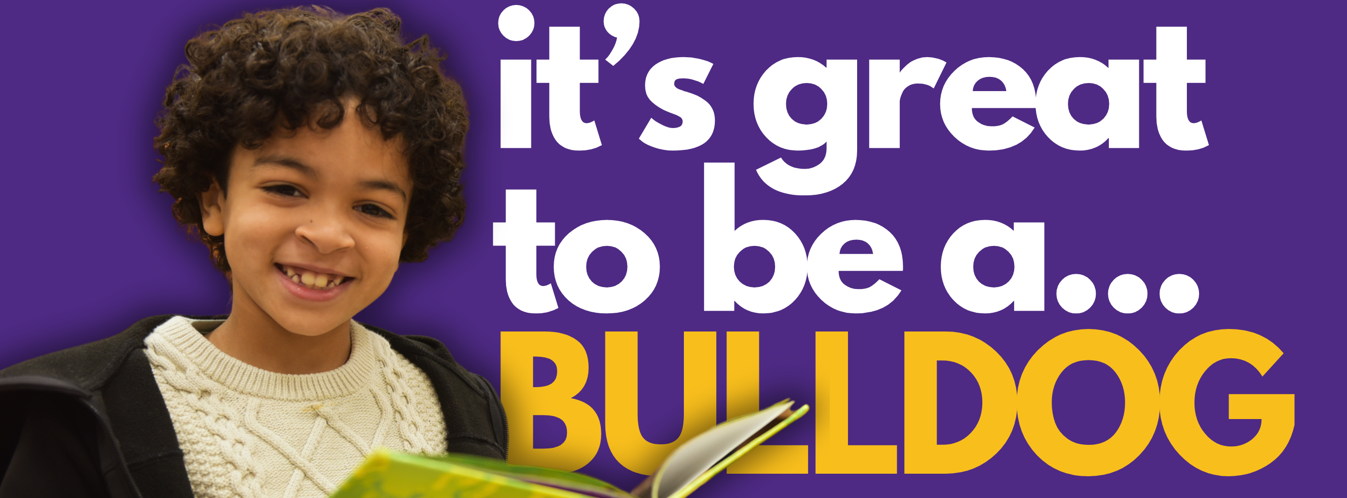 Smiling student holding a book with the text "It's great to be a... BULLDOG" on a purple background.