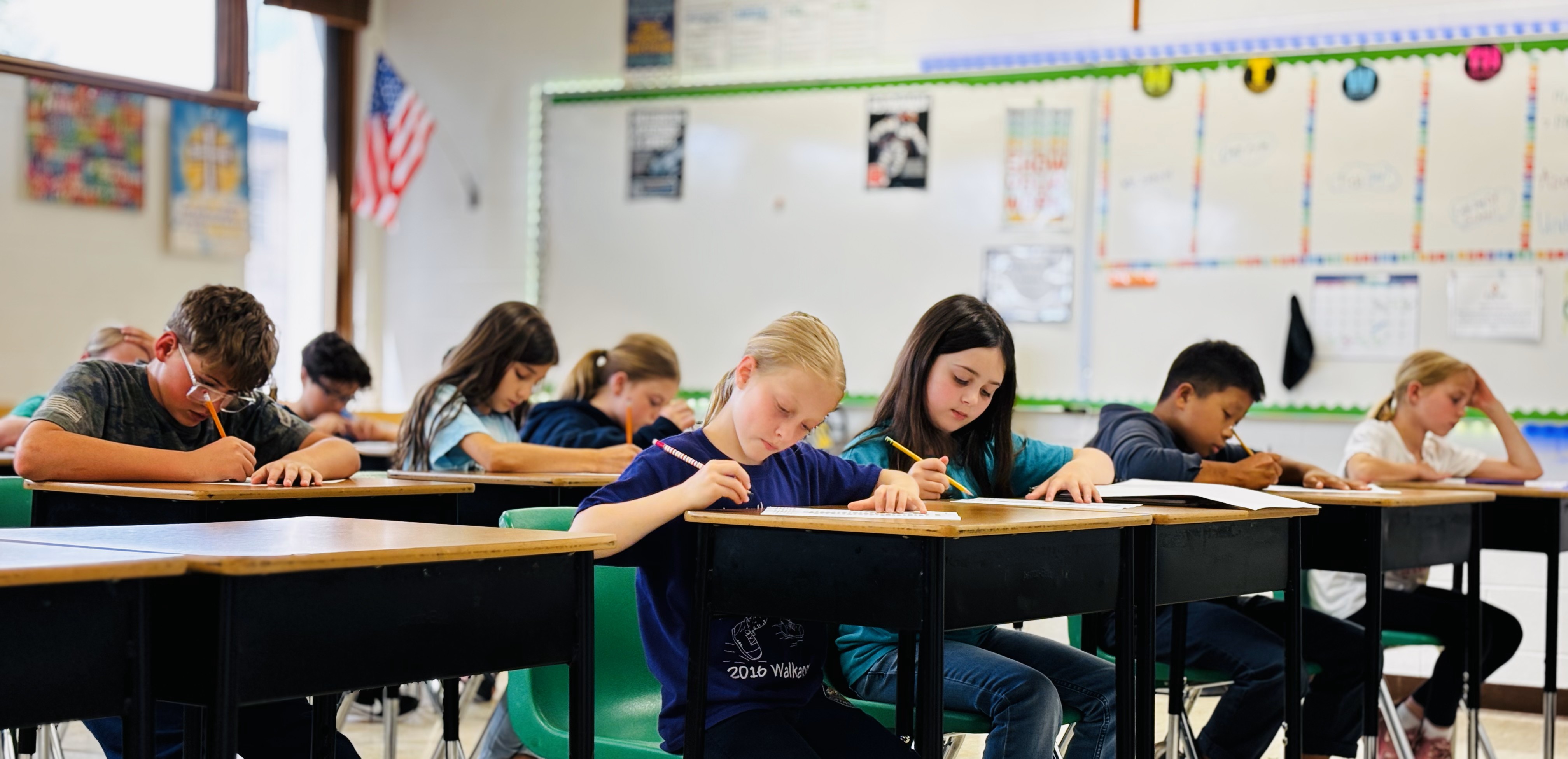 students writing on worksheets