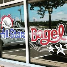  window featuring the Bagel All Star logo, showcasing a vibrant and inviting design.