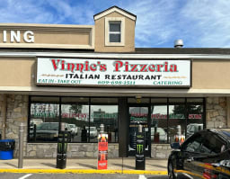 A cozy view of Vinnie's Pizzeria in New Jersey, showcasing its inviting atmosphere and delicious pizza offerings.