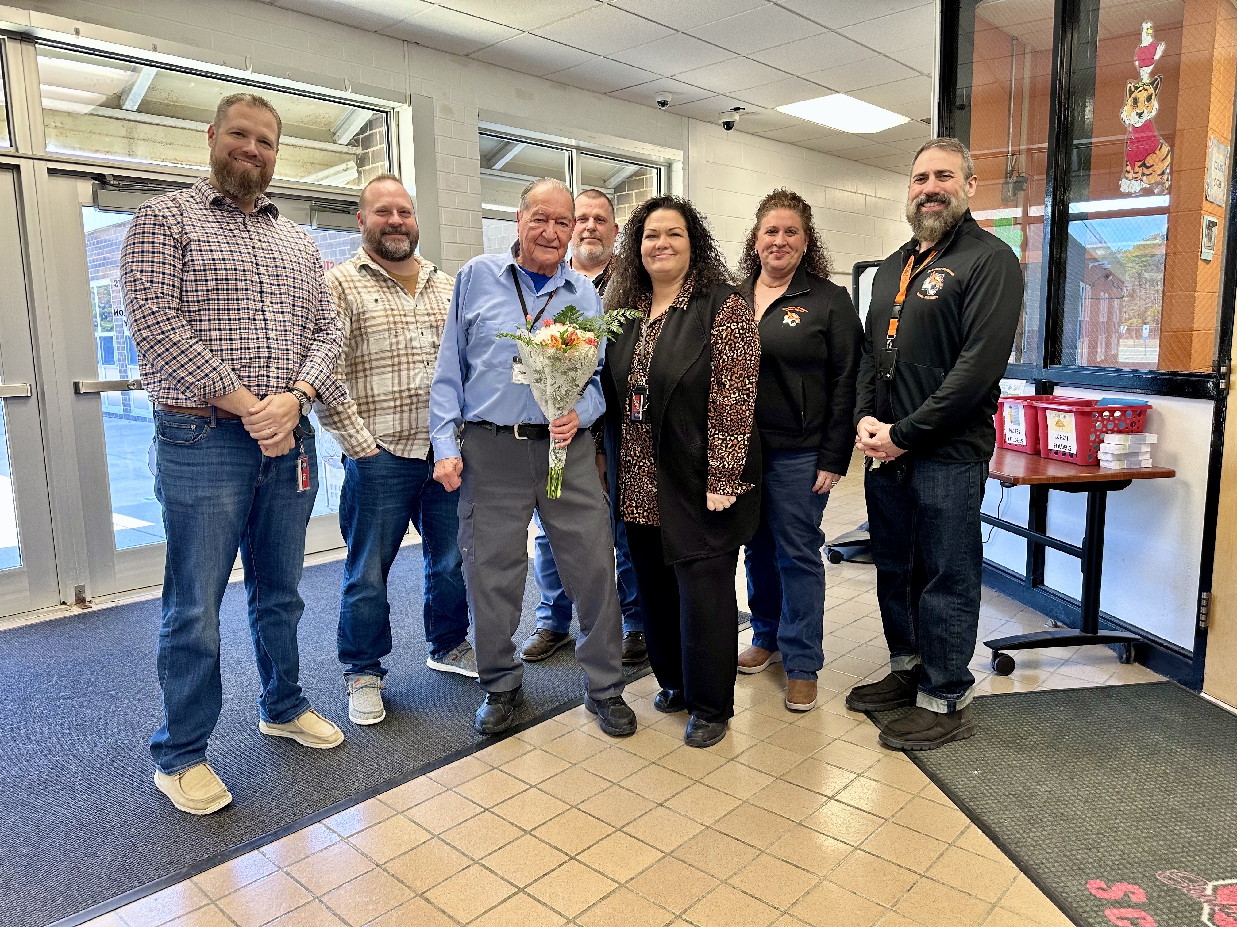 Outstanding Staff Member of the Year, Mr. Donald Kiefer, poses with district administration