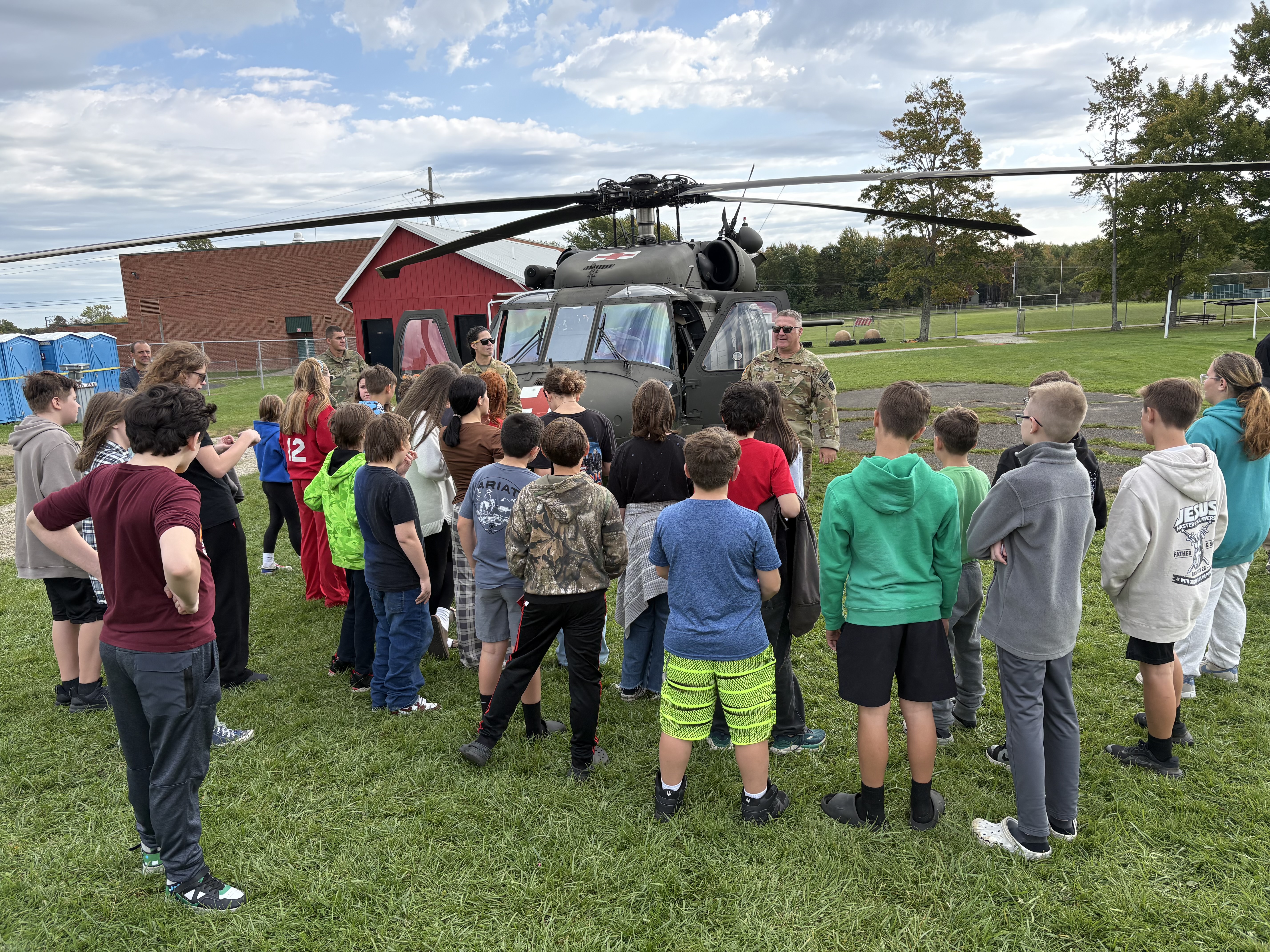 Students with Blackhawk helicopter as part of Parker Lord STEAM Day