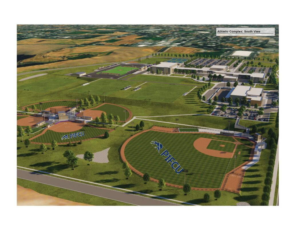 An aerial view of a sports complex featuring multiple baseball fields, green spaces, and a large building in the background.