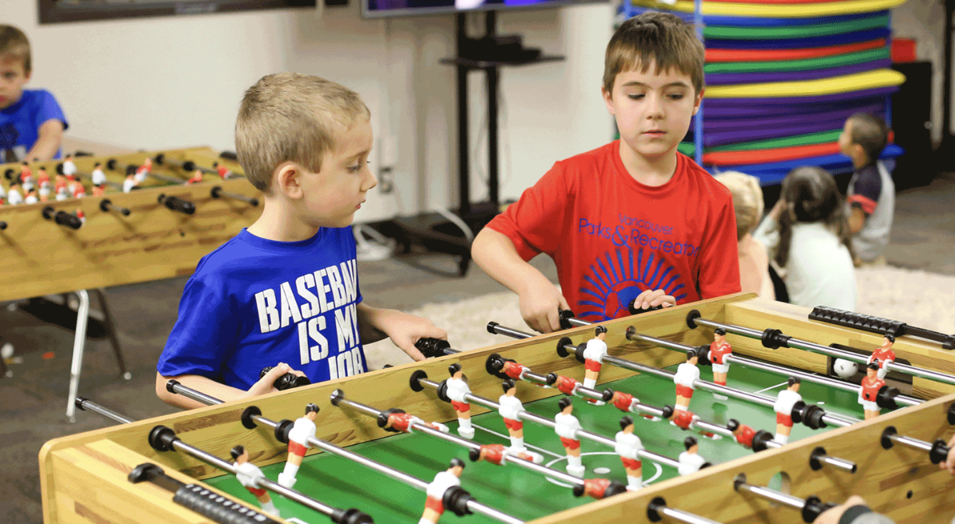 kids playin table soccer
