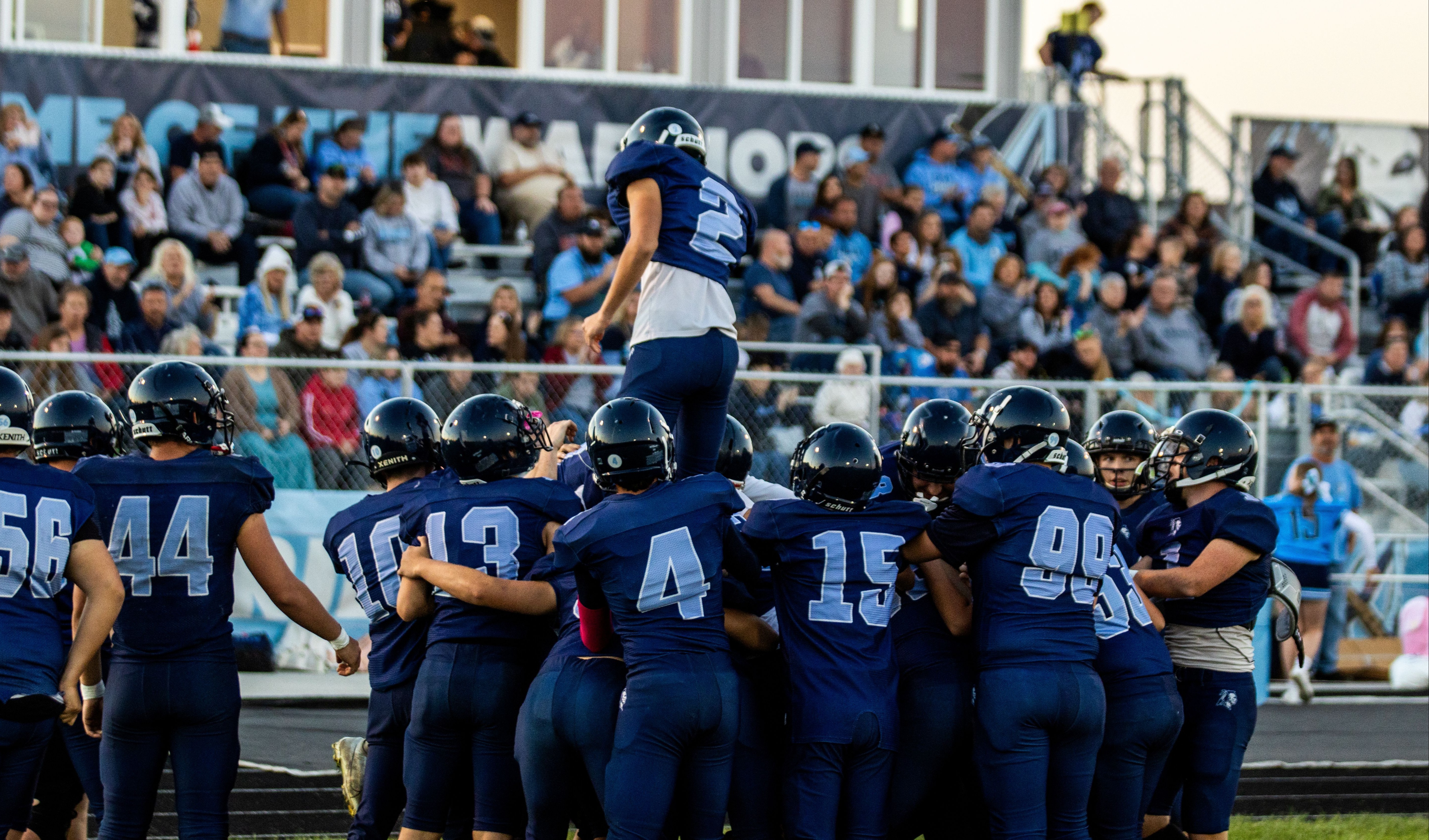 Members of the Adena football team celebrating a win. 