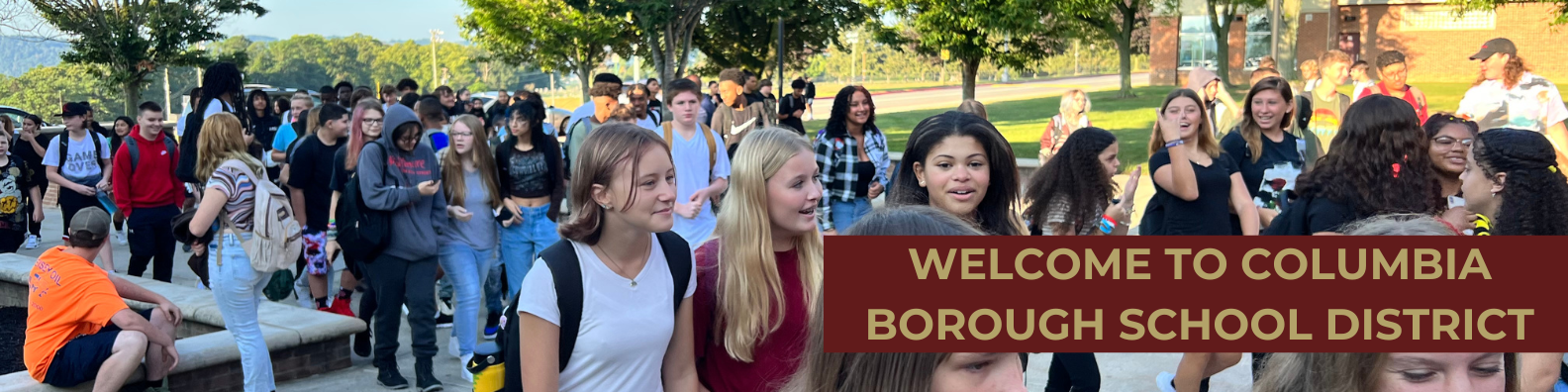 Photo of student outside CHS/CMS Hill Campus with Welcome to Columbia Borough School District