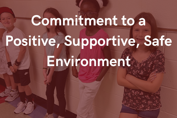 Commitment to a Positive, Supportive, Safe Environment in foreground with faded background of students lined up on a wall in the hallway
