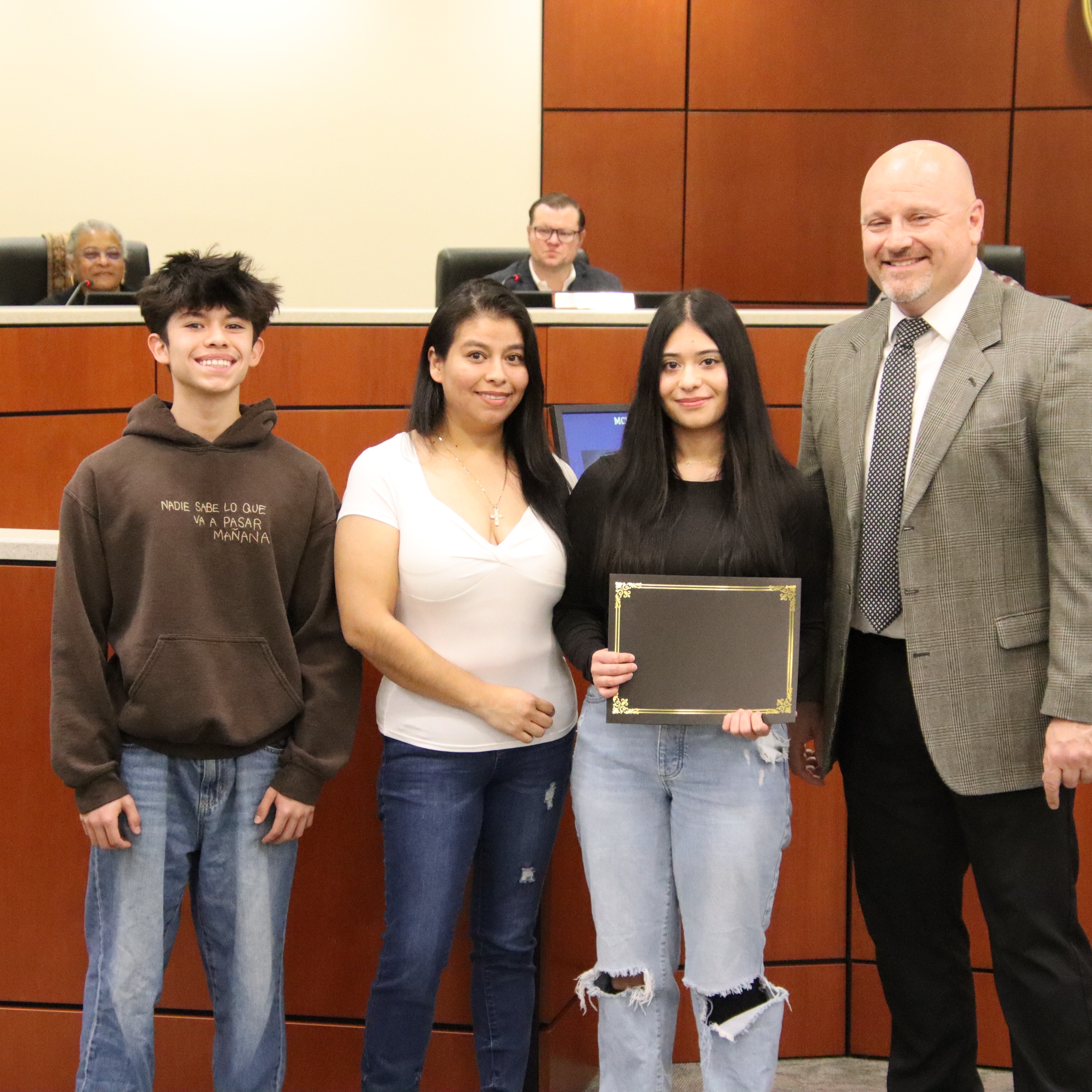 Ana Juarez standing with family