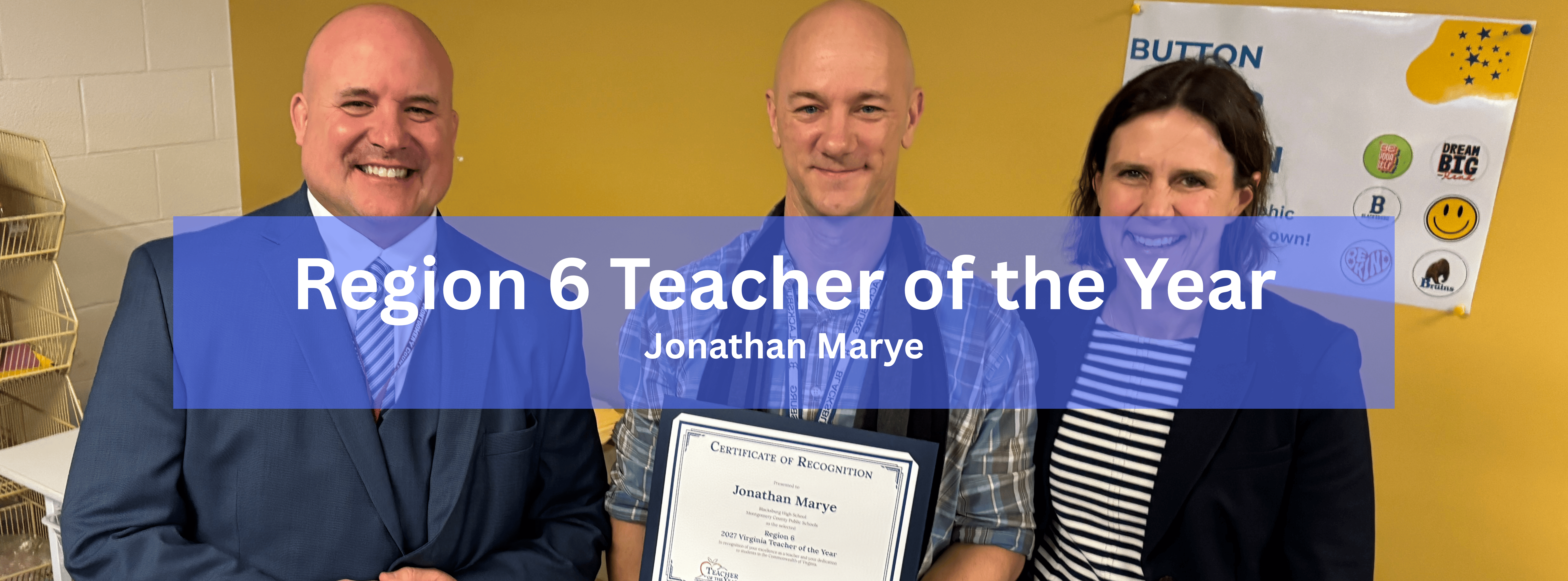 Three people standing together indoors as Jonathan Marye holds a "Region 6 Teacher of the Year" certificate. A blue banner overlay reads "Region 6 Teacher of the Year: Jonathan Marye."