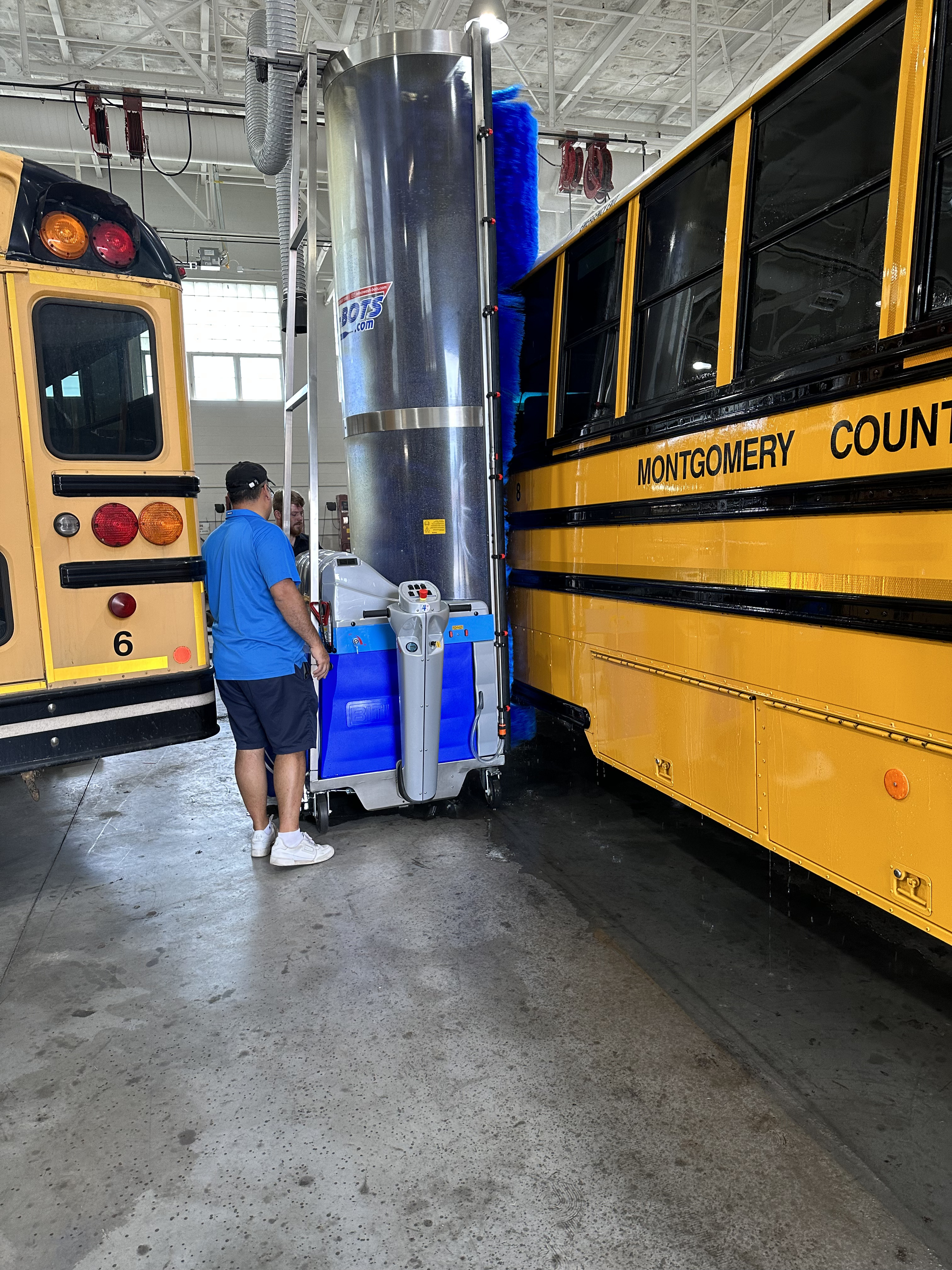 man working on a school bus