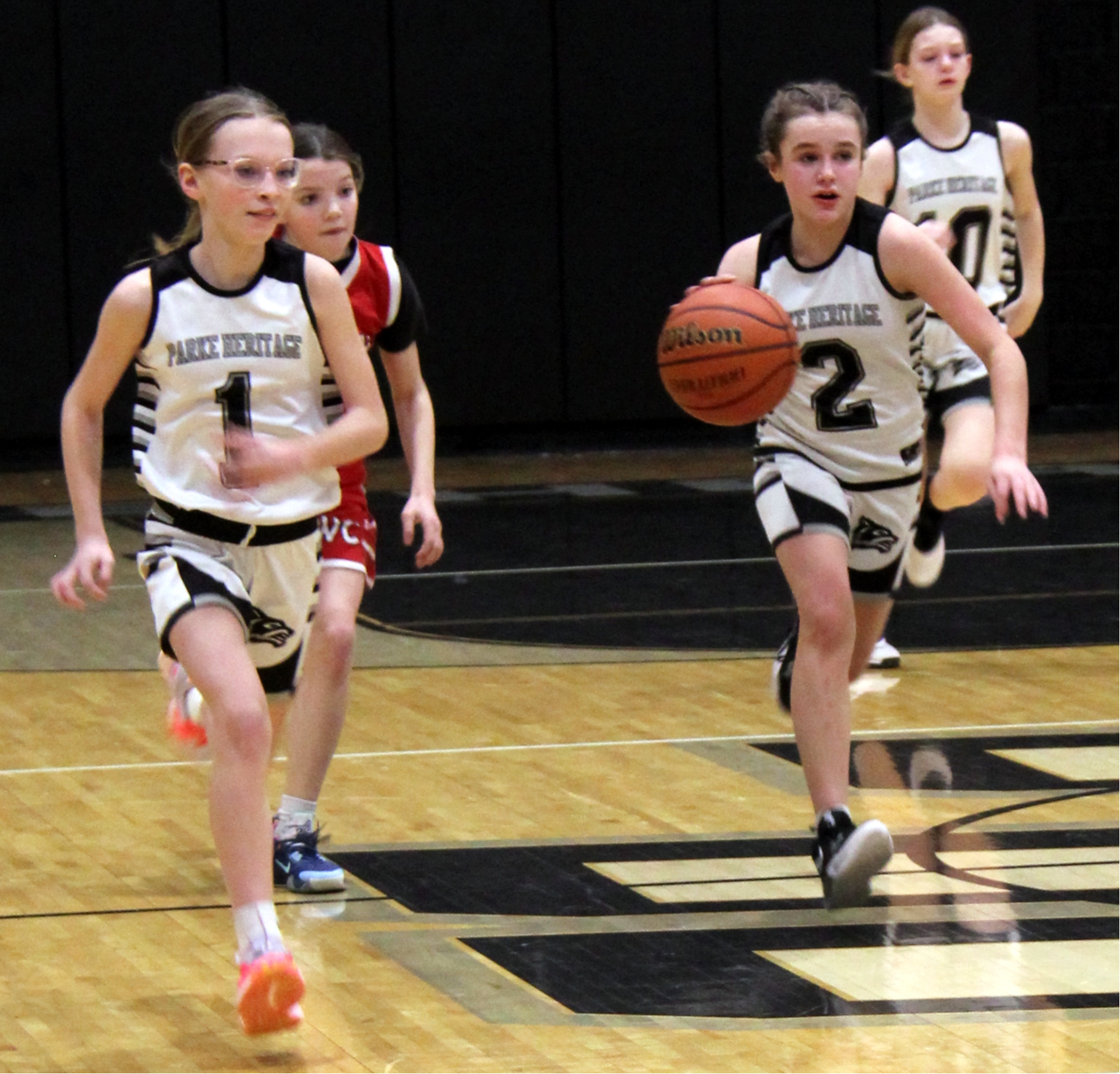 two basketball players on the court