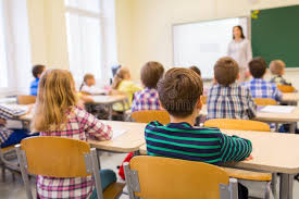 students sitting at desks in a classroom