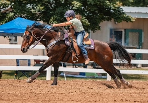 a girl barrel racing