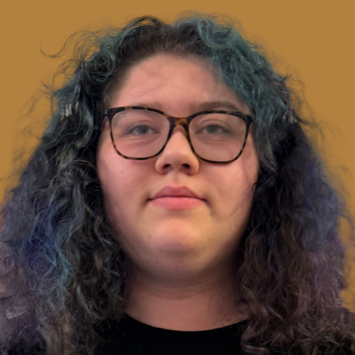 A person with curly hair and glasses holds a certificate reading "Student of the Month."